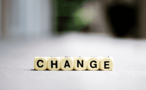 Dice lined up that say change